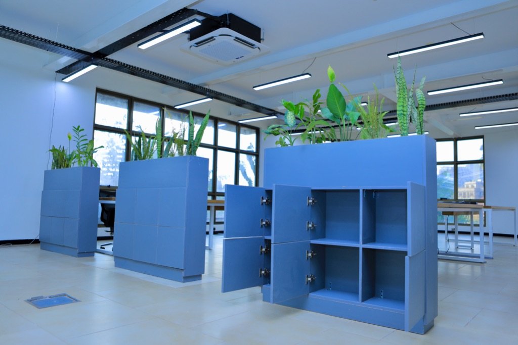 Custom blue storage lockers with integrated biophilic planters